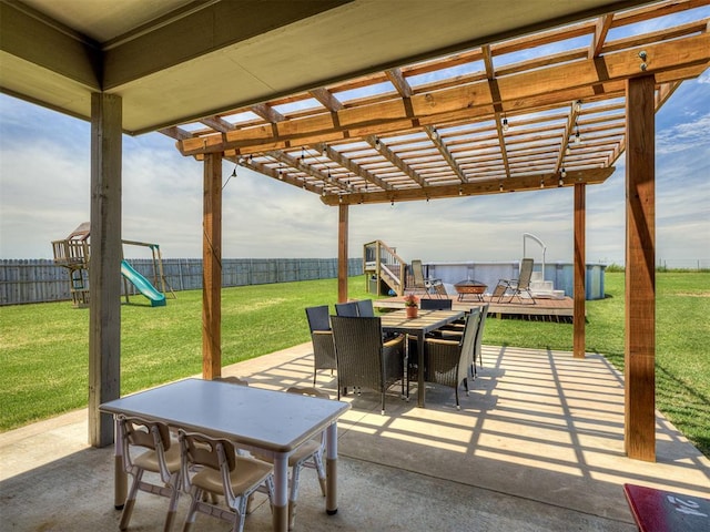 14325 Meadow Ridge Ln, Edmond, OK 73025 - fenced backyard featuring outdoor dining space, a pergola, a patio area, and a playground