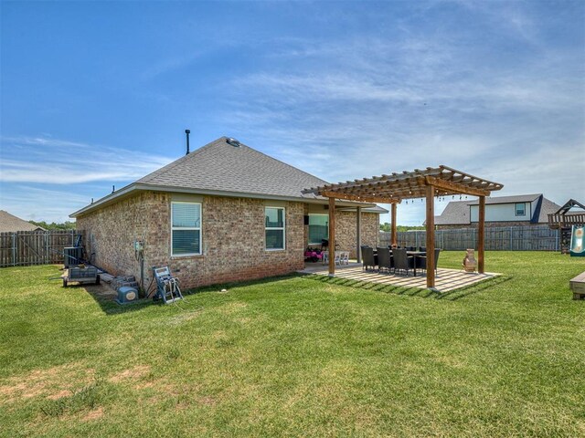 14325 Meadow Ridge Ln, Edmond, OK 73025 - rear view of property with a pergola, a fenced backyard, a patio, a shingled roof, and brick siding