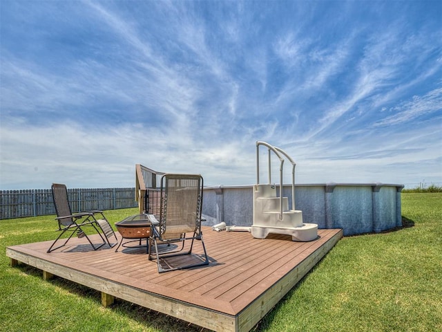14325 Meadow Ridge Ln, Edmond, OK 73025 - wooden deck with an outdoor fire pit