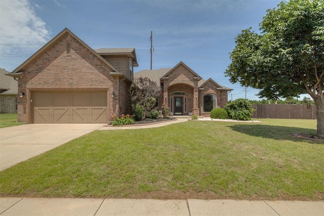 4501 NW 164th Ter, Edmond, OK 73013 - view of front facade with brick siding, driveway, and an attached garage
