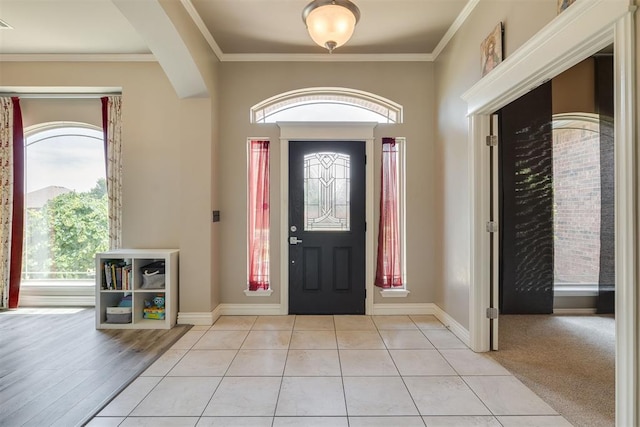4501 NW 164th Ter, Edmond, OK 73013 - entryway featuring plenty of natural light, crown molding, arched walkways, and light tile patterned floors