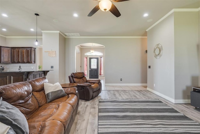 4501 NW 164th Ter, Edmond, OK 73013 - living area with arched walkways, a ceiling fan, recessed lighting, light wood finished floors, and ornamental molding