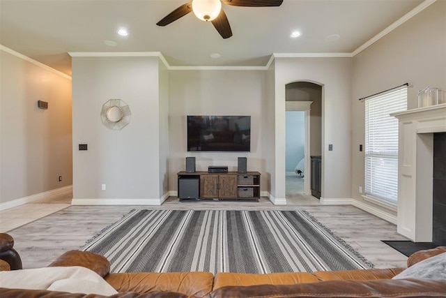 4501 NW 164th Ter, Edmond, OK 73013 - living room with arched walkways, ceiling fan, ornamental molding, recessed lighting, and wood finished floors