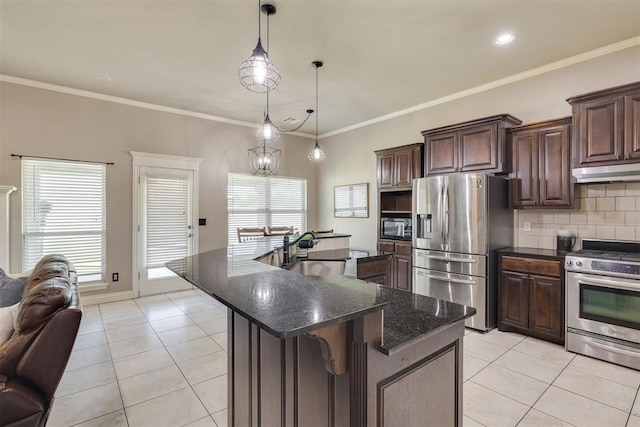 4501 NW 164th Ter, Edmond, OK 73013 - kitchen with appliances with stainless steel finishes, light tile patterned flooring, a center island with sink, backsplash, and dark brown cabinets