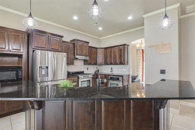 4501 NW 164th Ter, Edmond, OK 73013 - kitchen featuring stainless steel appliances, light tile patterned flooring, decorative backsplash, under cabinet range hood, and crown molding