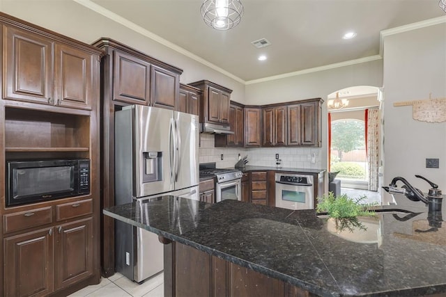 4501 NW 164th Ter, Edmond, OK 73013 - kitchen with appliances with stainless steel finishes, under cabinet range hood, decorative backsplash, dark brown cabinets, and light tile patterned floors