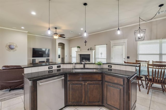 4501 NW 164th Ter, Edmond, OK 73013 - kitchen featuring stainless steel dishwasher, open floor plan, a center island with sink, ceiling fan, and crown molding