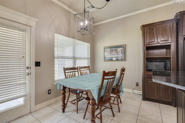 4501 NW 164th Ter, Edmond, OK 73013 - dining room with crown molding, light tile patterned floors, a chandelier, and plenty of natural light