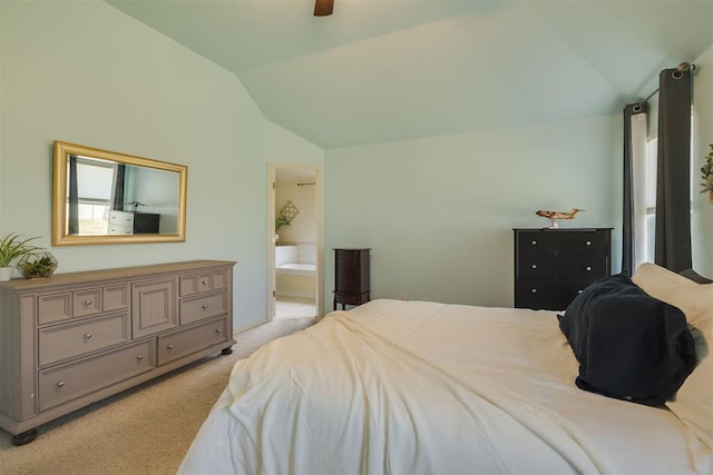4501 NW 164th Ter, Edmond, OK 73013 - bedroom with vaulted ceiling, light colored carpet, connected bathroom, and ceiling fan