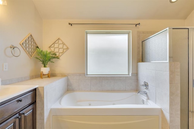 4501 NW 164th Ter, Edmond, OK 73013 - full bathroom featuring vanity, a tub with jets, and a shower stall