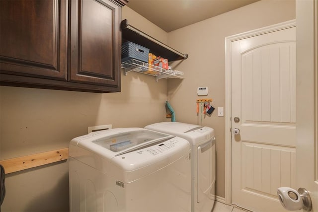 4501 NW 164th Ter, Edmond, OK 73013 - laundry area featuring washer and clothes dryer and cabinet space