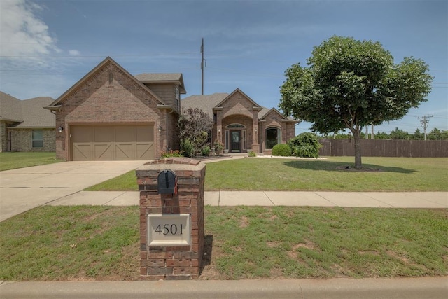 4501 NW 164th Ter, Edmond, OK 73013 - traditional-style home featuring brick siding, concrete driveway, and a garage