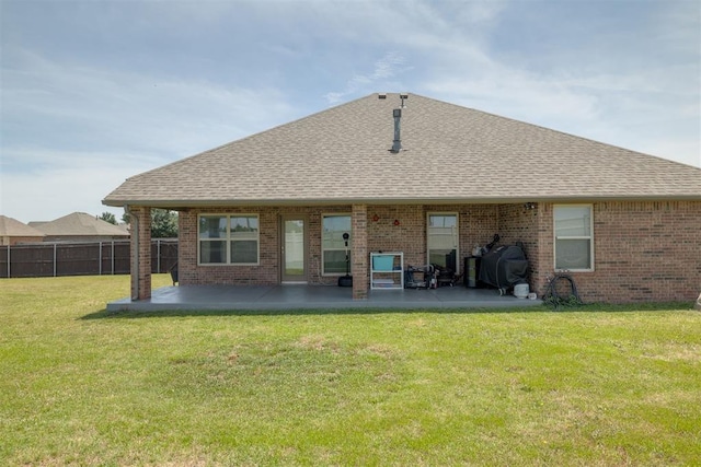 4501 NW 164th Ter, Edmond, OK 73013 - back of property with roof with shingles, a patio, and brick siding