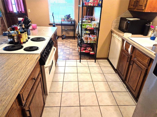 3120 Del Rey Dr, Midwest City, OK 73110 - kitchen with white appliances and light countertops