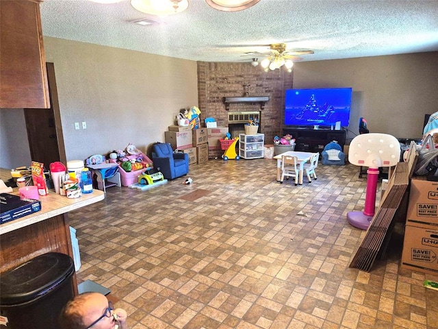 3120 Del Rey Dr, Midwest City, OK 73110 - game room featuring a ceiling fan, brick patterned flooring, and a brick fireplace