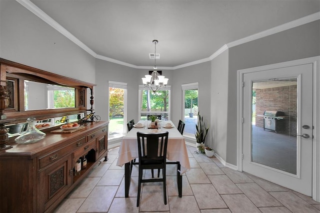 1840 Kamber Ter, Edmond, OK 73003 - dining room with a chandelier, healthy amount of natural light, light tile patterned floors, and ornamental molding