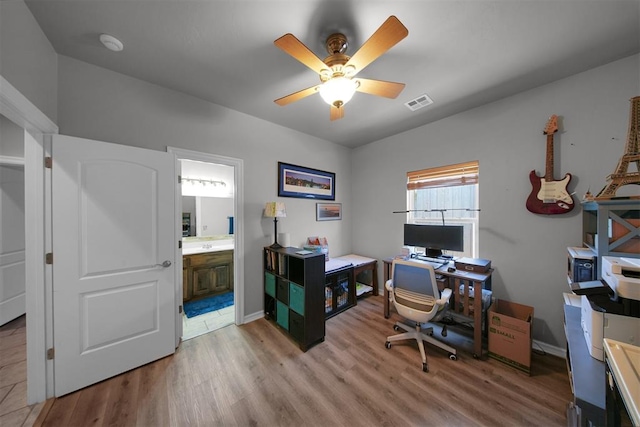 1840 Kamber Ter, Edmond, OK 73003 - home office with light wood-style floors and a ceiling fan