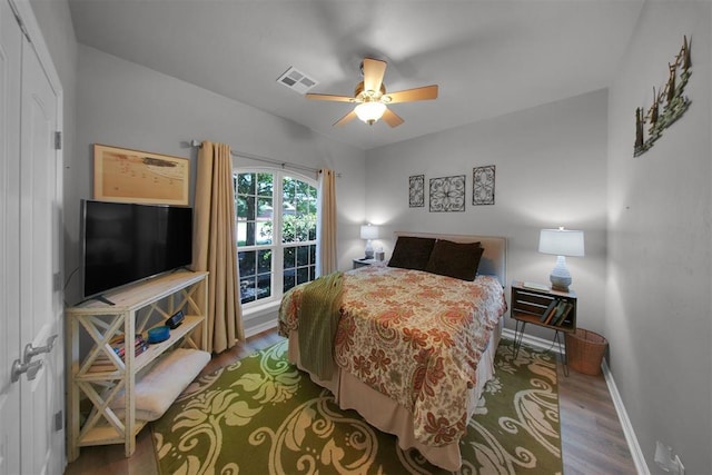 1840 Kamber Ter, Edmond, OK 73003 - bedroom with wood finished floors and ceiling fan