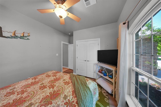 1840 Kamber Ter, Edmond, OK 73003 - bedroom with ceiling fan, a closet, and wood finished floors