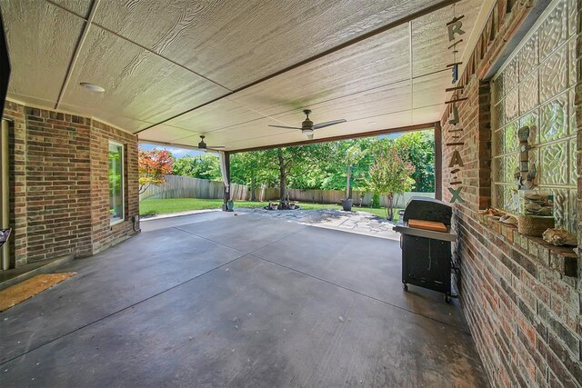 1840 Kamber Ter, Edmond, OK 73003 - fenced backyard featuring grilling area, a patio, and a ceiling fan