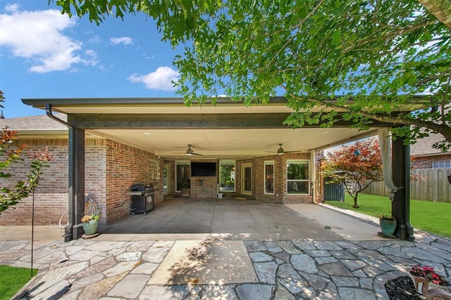1840 Kamber Ter, Edmond, OK 73003 - view of patio / terrace featuring a ceiling fan, an attached carport, area for grilling, and driveway