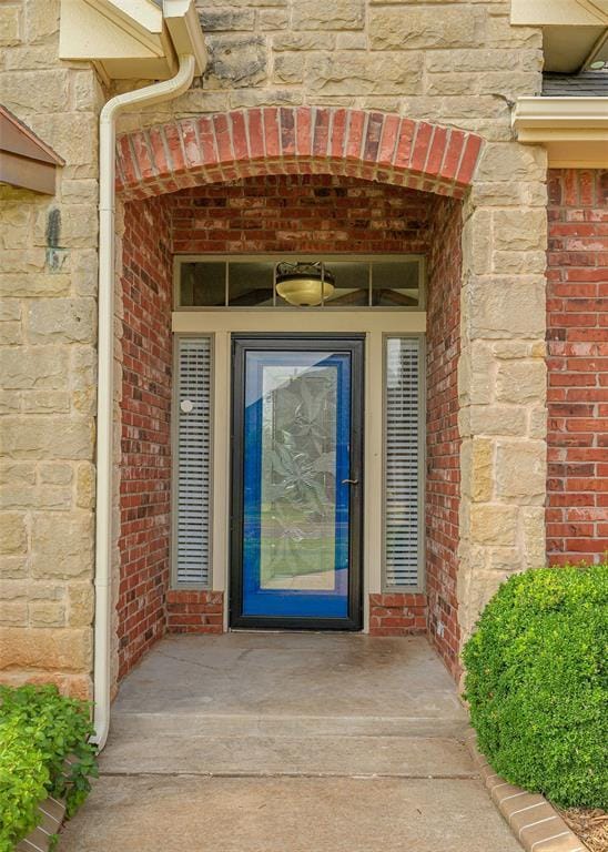 5404 NW 119th St, Oklahoma City, OK 73162 - view of exterior entry featuring brick siding and stone siding