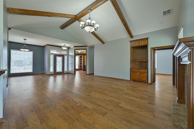 5404 NW 119th St, Oklahoma City, OK 73162 - unfurnished living room with a chandelier and wood finished floors