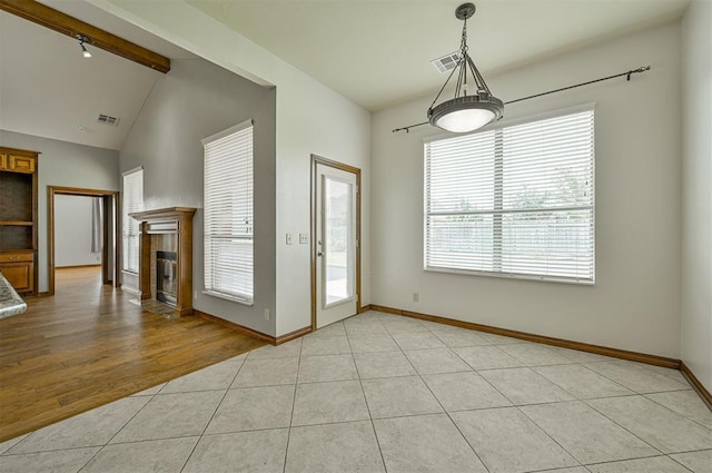 5404 NW 119th St, Oklahoma City, OK 73162 - unfurnished dining area with a fireplace and light tile patterned flooring