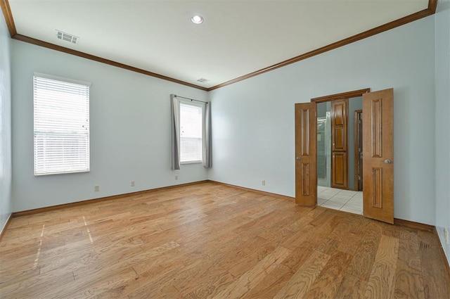5404 NW 119th St, Oklahoma City, OK 73162 - spare room with crown molding, light wood-type flooring, and recessed lighting
