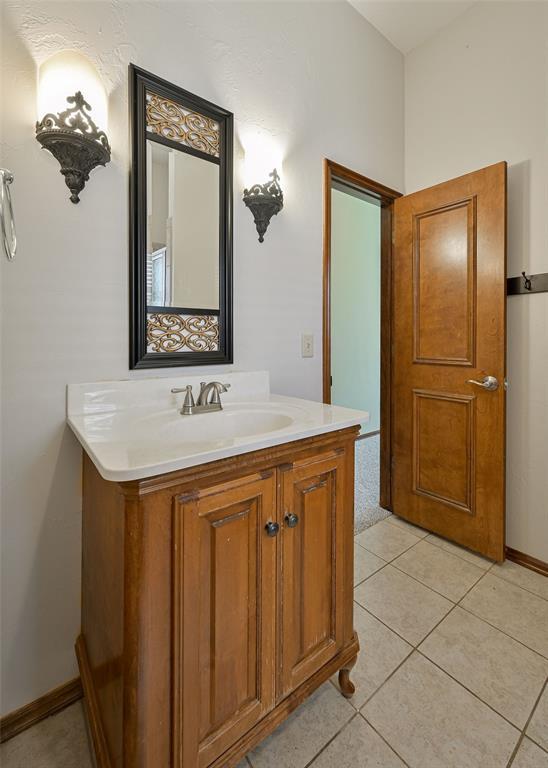 5404 NW 119th St, Oklahoma City, OK 73162 - bathroom with vanity and tile patterned floors
