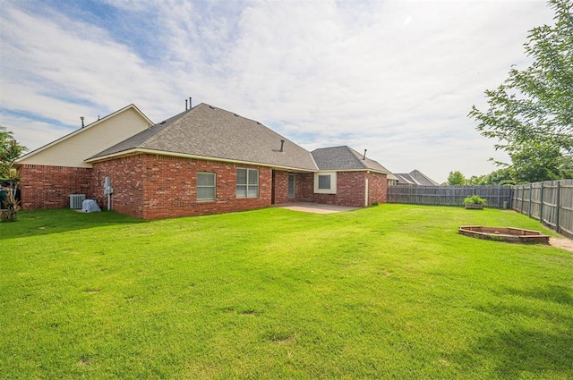 5404 NW 119th St, Oklahoma City, OK 73162 - back of property featuring a patio area, a fenced backyard, brick siding, and a shingled roof