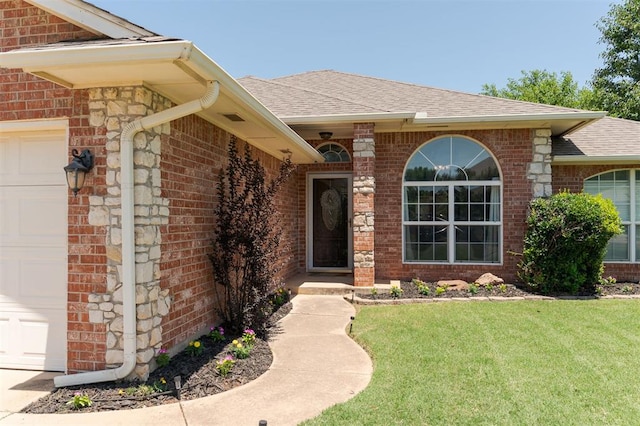 2001 Fair Meadow Dr, Edmond, OK 73003 - doorway to property featuring an attached garage, roof with shingles, brick siding, and a yard