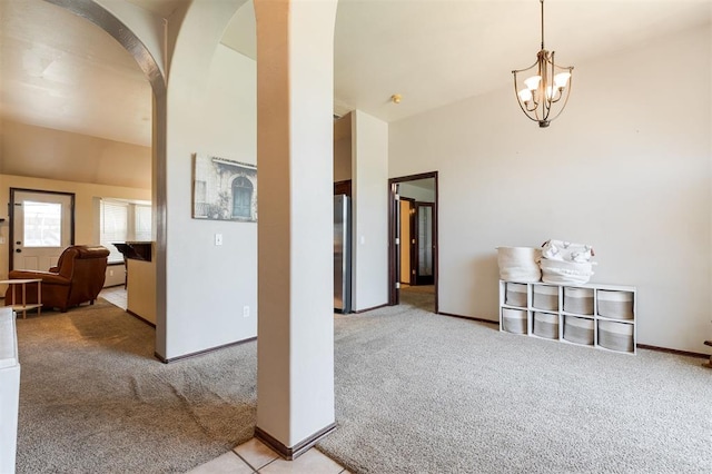 2001 Fair Meadow Dr, Edmond, OK 73003 - dining area featuring light colored carpet, arched walkways, and a chandelier
