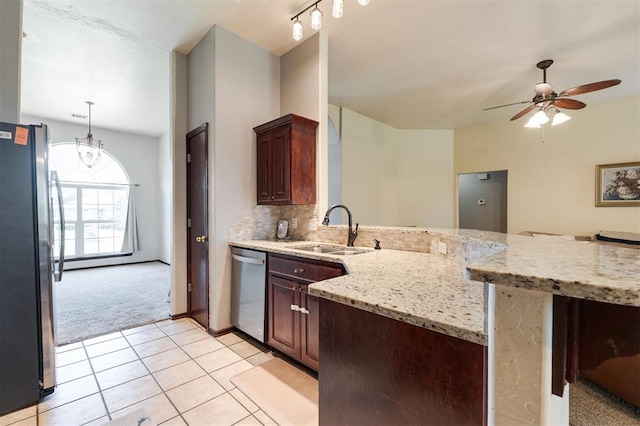 2001 Fair Meadow Dr, Edmond, OK 73003 - kitchen featuring appliances with stainless steel finishes, a peninsula, light colored carpet, ceiling fan, and light tile patterned flooring