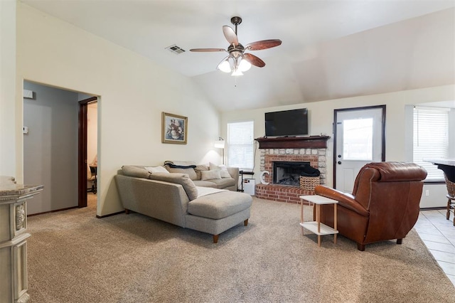 2001 Fair Meadow Dr, Edmond, OK 73003 - living area with ceiling fan, vaulted ceiling, a fireplace, and light carpet