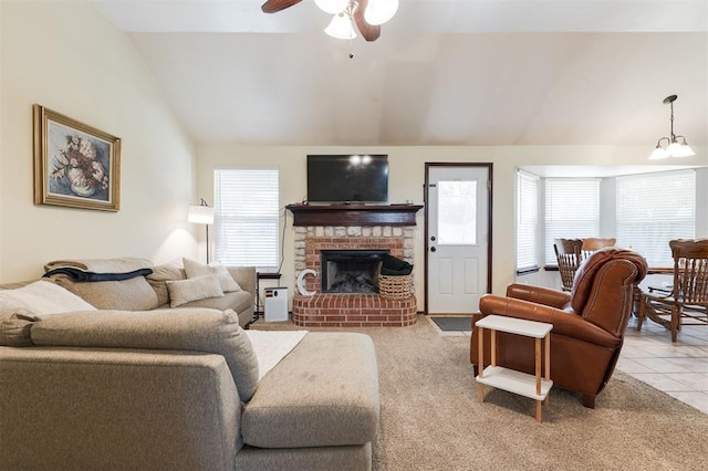 2001 Fair Meadow Dr, Edmond, OK 73003 - living room with lofted ceiling, ceiling fan, a brick fireplace, light tile patterned floors, and light carpet