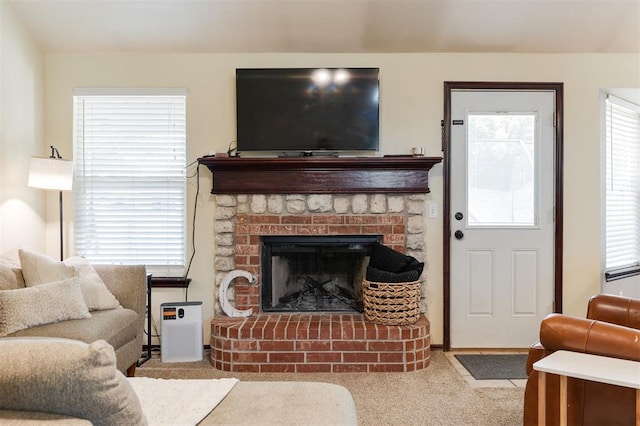 2001 Fair Meadow Dr, Edmond, OK 73003 - living area with carpet floors, plenty of natural light, and a fireplace with raised hearth