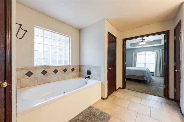 2001 Fair Meadow Dr, Edmond, OK 73003 - ensuite bathroom with a whirlpool tub, tile patterned floors, and a ceiling fan