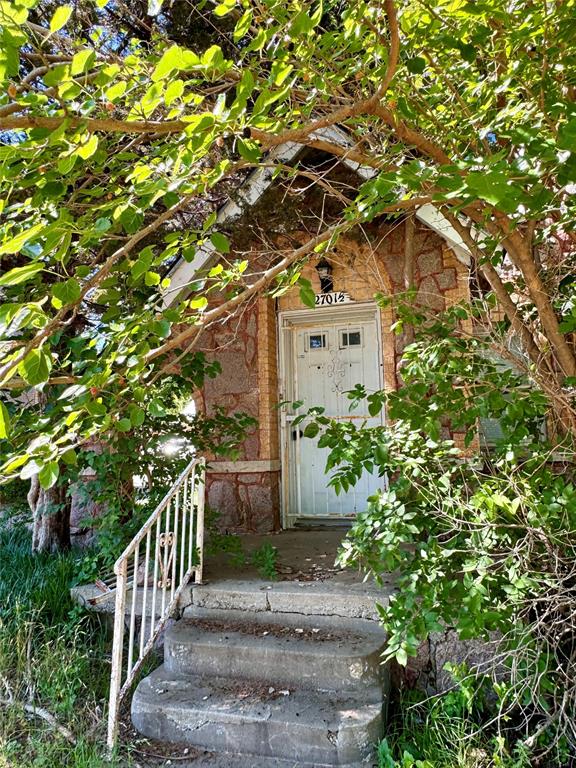 2701 NW 12th St, Oklahoma City, OK 73107 - doorway to property with brick siding