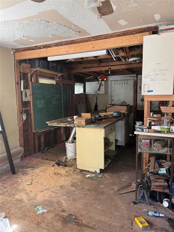 2701 NW 12th St, Oklahoma City, OK 73107 - basement with a workshop area