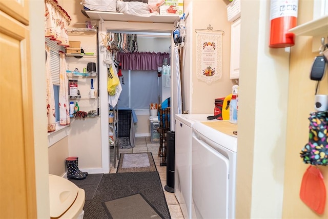 828 N Pine St, Pauls Valley, OK 73075 - washroom featuring washing machine and dryer and light tile patterned floors