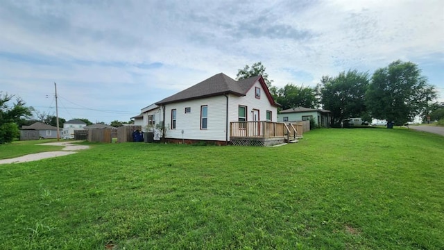 1401 W College Ave, Guthrie, OK 73044 - view of property exterior featuring a deck and a yard