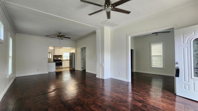 1401 W College Ave, Guthrie, OK 73044 - unfurnished living room with ceiling fan, ornamental molding, and dark wood-style flooring