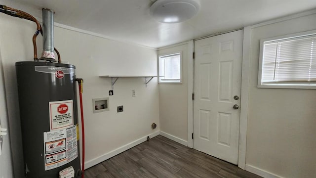 1401 W College Ave, Guthrie, OK 73044 - washroom featuring electric dryer hookup, gas water heater, washer hookup, and dark wood-style floors