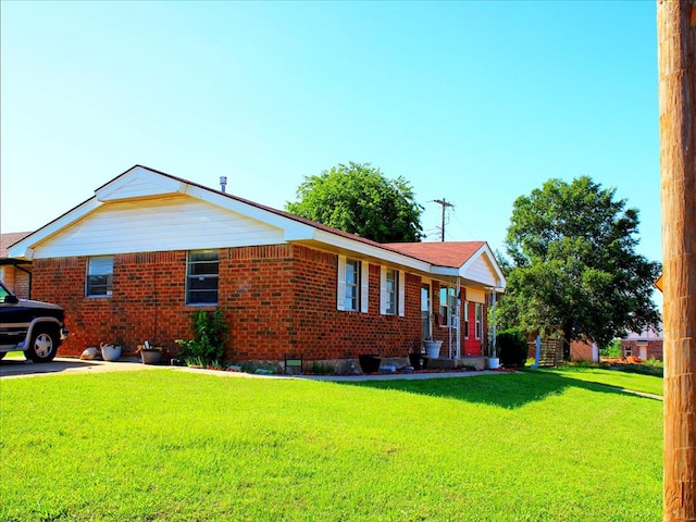 2605 N Kate Ave, Oklahoma City, OK 73111 - view of front of home featuring a front yard and brick siding