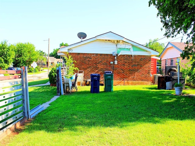 2605 N Kate Ave, Oklahoma City, OK 73111 - rear view of house featuring brick siding