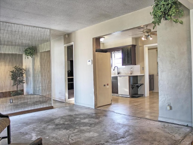 2605 N Kate Ave, Oklahoma City, OK 73111 - unfurnished living room featuring concrete flooring, a ceiling fan, and a textured ceiling