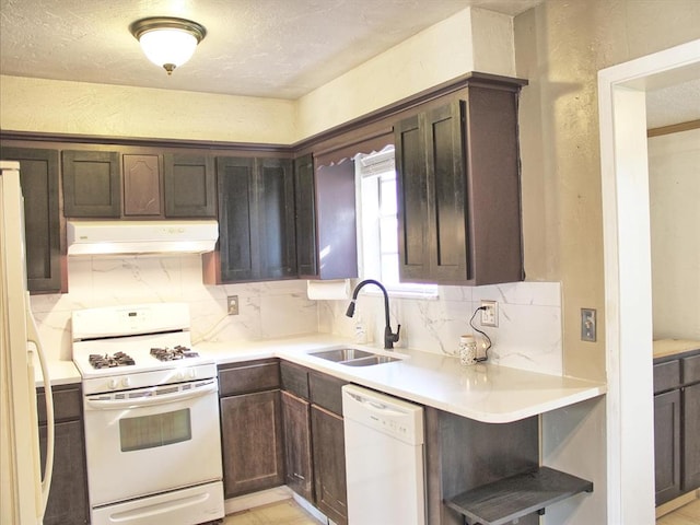 2605 N Kate Ave, Oklahoma City, OK 73111 - kitchen featuring white appliances, ventilation hood, backsplash, dark brown cabinetry, and light countertops