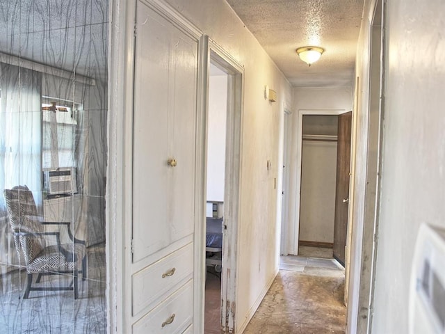 2605 N Kate Ave, Oklahoma City, OK 73111 - hall featuring a textured ceiling and baseboards