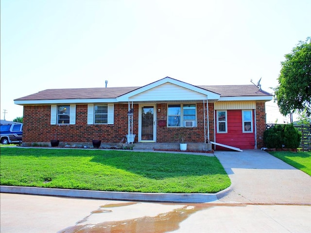 2605 N Kate Ave, Oklahoma City, OK 73111 - ranch-style house with a front yard and brick siding